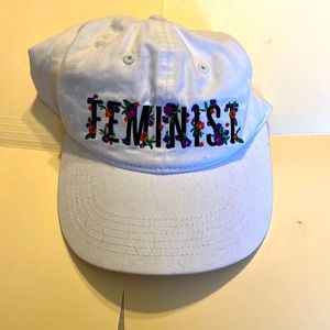 Baseball cap style white adjustable floral hat with Feminist embroidered front